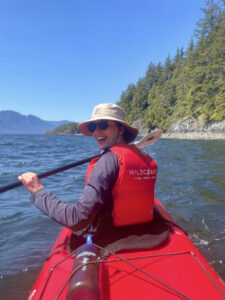 Maddie in a red kayak